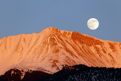 Moon-rise over a snowy mountain in the Lost River Range of Idaho.