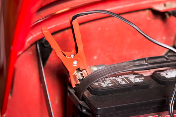 istock Battery Charger being used on a 1983 vintage vehicle. 1314569043