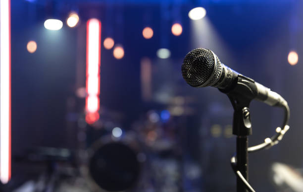 istock Close up microphone on blurred background with bokeh. 1314569360