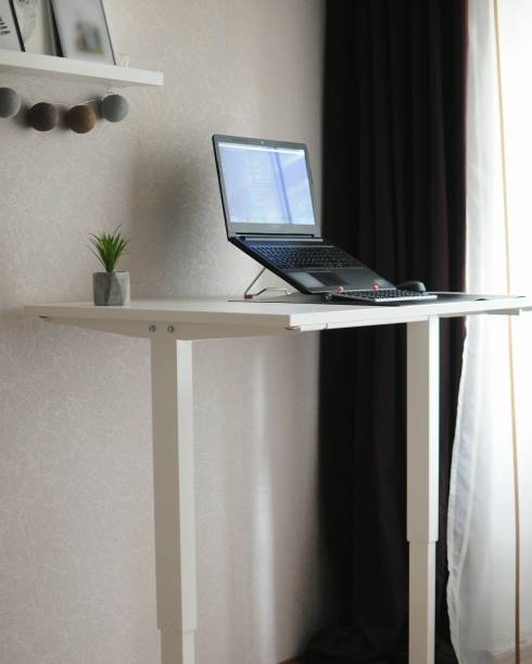 Work home place with standing table Work home place with sit-standing table standing desk photos stock pictures, royalty-free photos & images