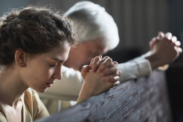 istock People praying in the church 1314575300