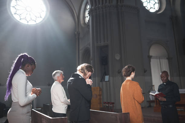 istock People standing in the church 1314575669