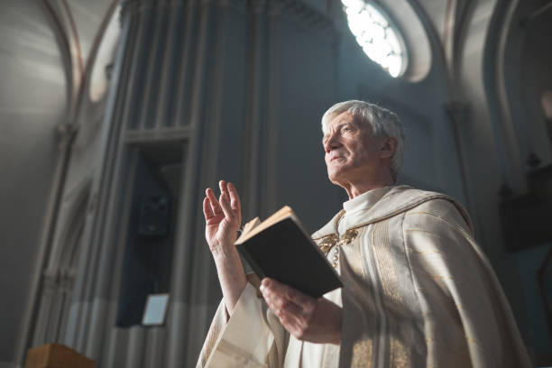 istock Senior man serving in the church 1314576368