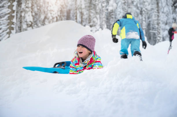 istock Girl playing on snowy landscape 1314577031
