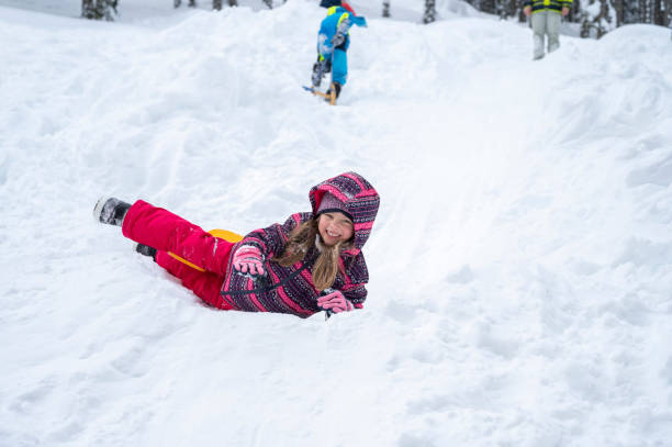 istock Girl playing on snowy landscape 1314577160