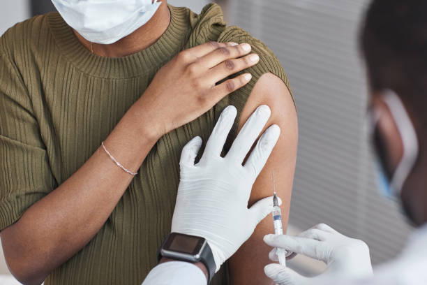 istock Doctor making an injection to the patient 1314577235