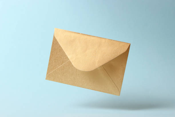istock The envelope falls to the ground on a colored background. 1314578039
