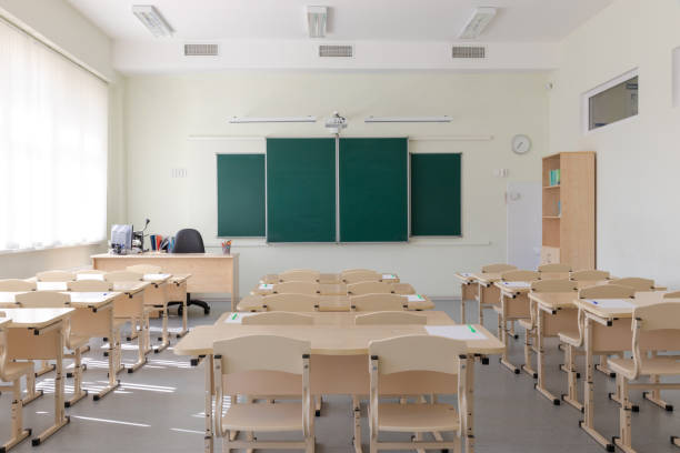 istock empty school class before final exams. sheets with handles are laid out on the desks 1314579108