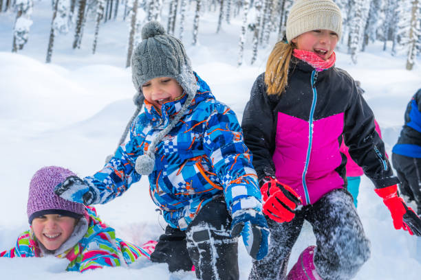 istock Children playing in snowy landscape 1314579229