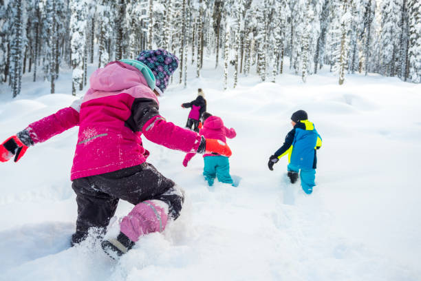 istock Children walking in snowy landscape 1314579230