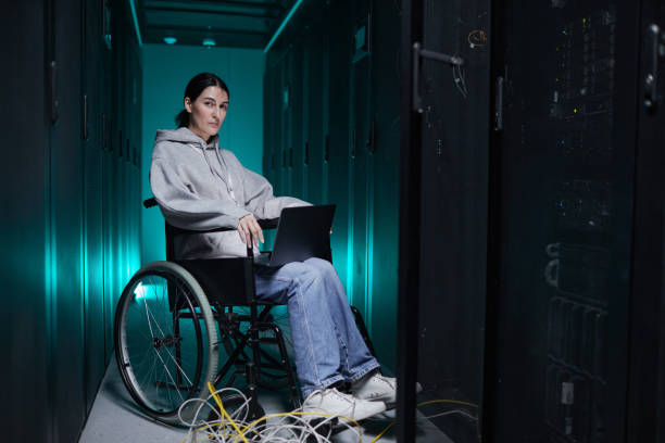 istock Female Network Engineer in Wheelchair 1314580011