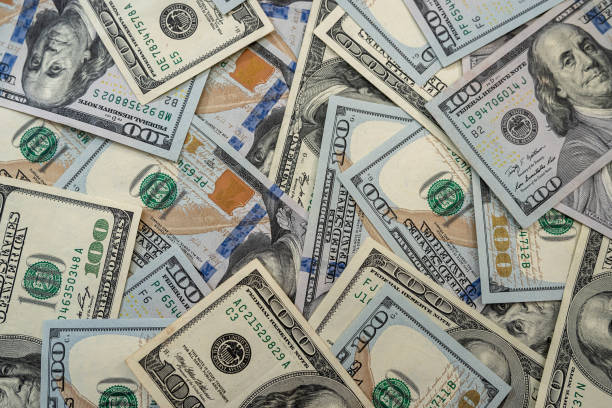 istock Close up view of money stack of 100 US dollars banknotes 1314580174