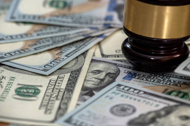 istock Wooden gavel on american dollars bills 1314583200
