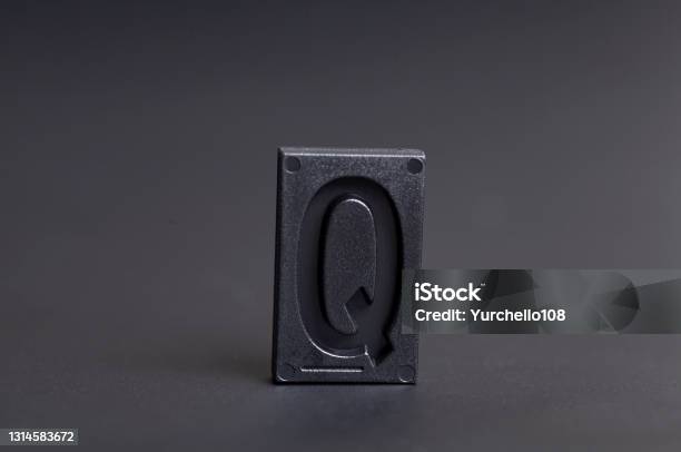 Letter Press Q On Black Background Stock Photo - Download Image Now - Abstract, Alphabet, Antique
