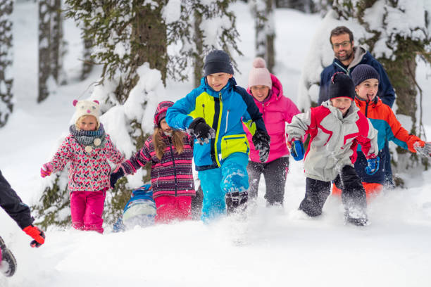 istock Family playing in snow 1314584488