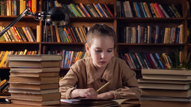 istock Tired young lady in brown jacket writes material from book 1314585856