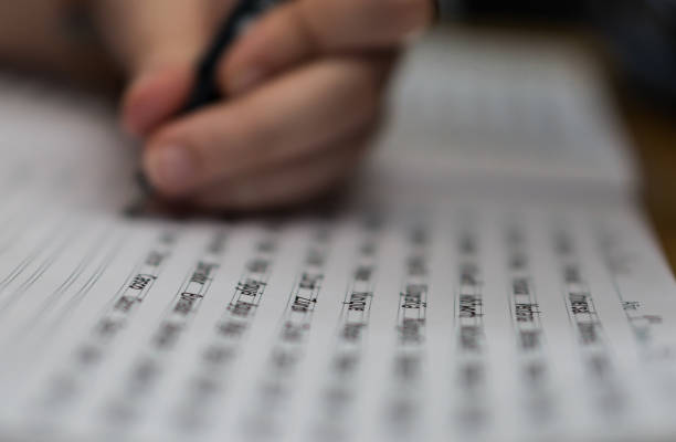 istock Left handed girl doing homework 1314586242