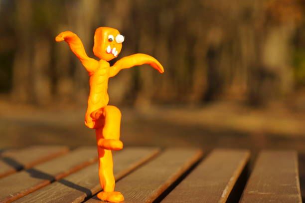 Orange zombie stands in a yoga pose.