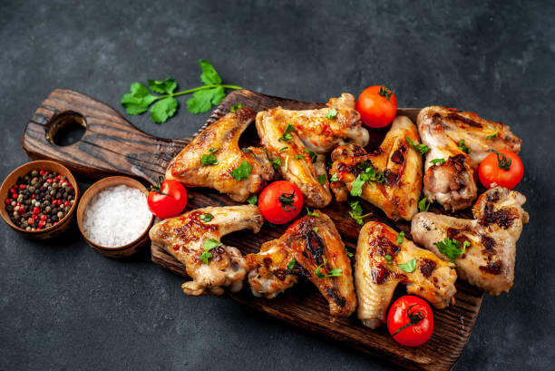 istock grilled chicken wings with spices on a stone background 1314588405