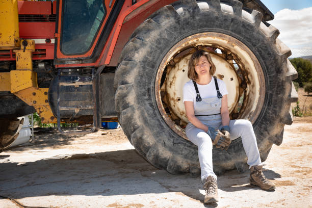 istock Woman mechanic sitting resting from work on the wheel of a lorry 1314590077