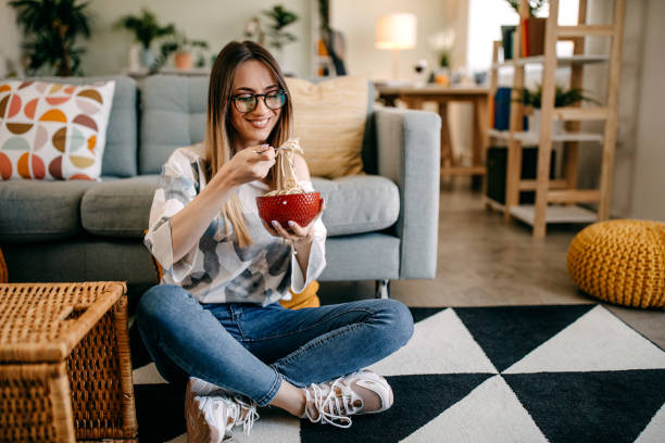 istock Woman eating spaghetti bolognese 1314591655