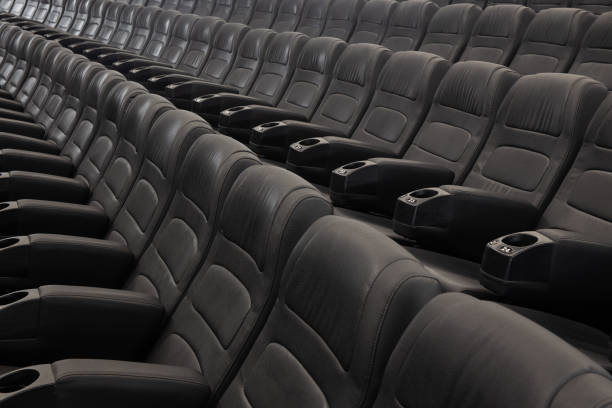 istock Empty Black Leather Seats In Row At Movie Theater 1314591881
