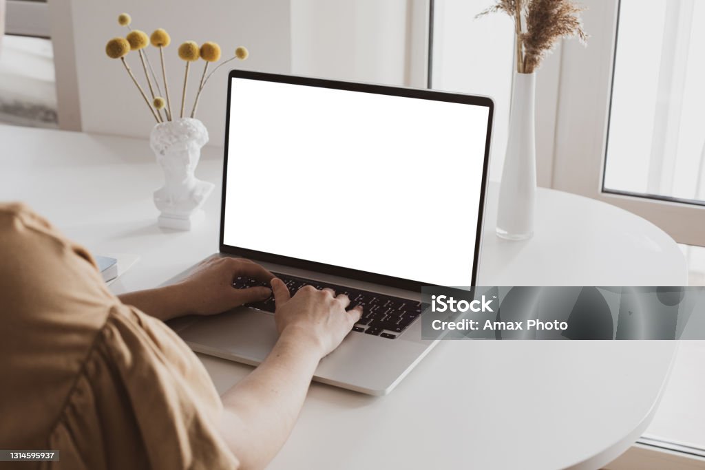 COVID-19 working from home concept COVID-19 working from home concept with white blank screen laptop Template Stock Photo