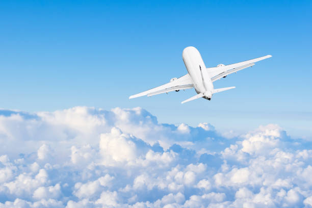 istock The plane flies high in the sky among the clouds. 1314597069