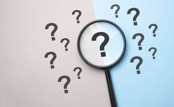 Magnifying glass with question mark symbol. Concept creative idea and innovation stock photo