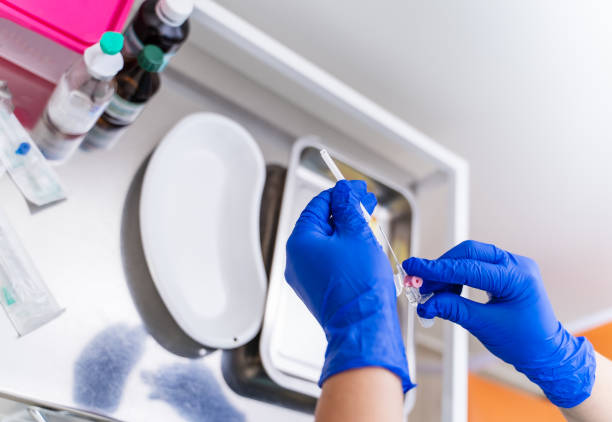 istock Gloved hand hold the pipette with blood for analysis. Plastic labware for scientific research. Scientist is analyzing blood sample in laboratory. 1314598708