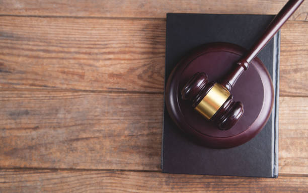 istock Gavel with book on a wood surface. 1314603538