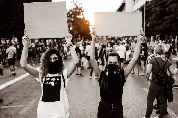 istock Young women protesters holding blank placards 1314604583
