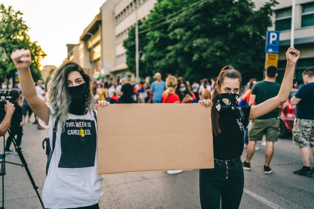 istock Protestant women holding a blank placard 1314604693