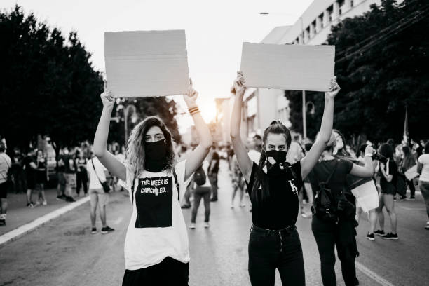 istock Young women protesters holding blank placards 1314605023