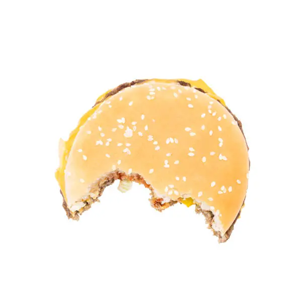 bitten hamburger isolated on white background. burger cut out. unhealthy eating concept.