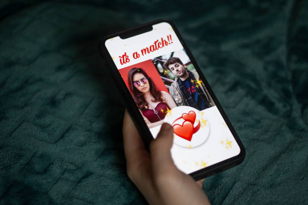 Young woman using online dating app stock photo