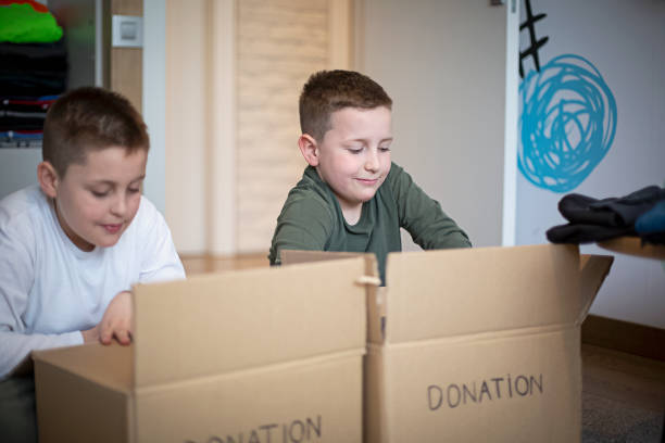istock Children sorting clothes from their closet for donation 1314608406