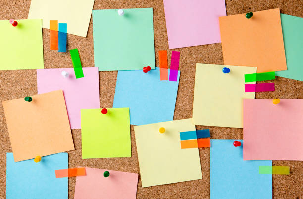 istock Cork board with a lot of pinned colored blank notes. 1314615038
