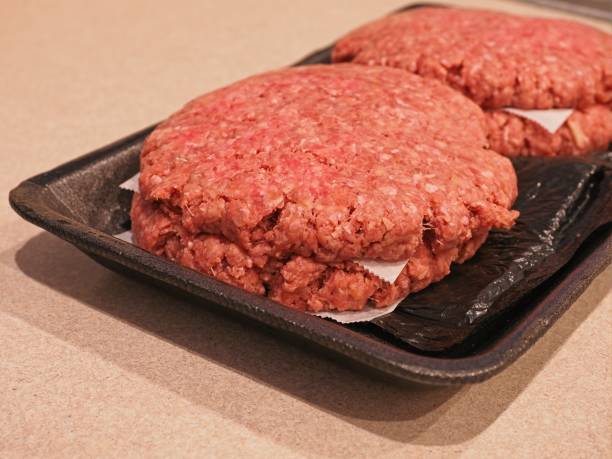 istock Fresh ground beef hamburger patties on Styrofoam meat tray 1314616232