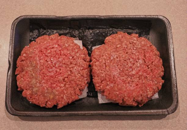 istock Fresh ground beef hamburger patties on Styrofoam meat 1314616233
