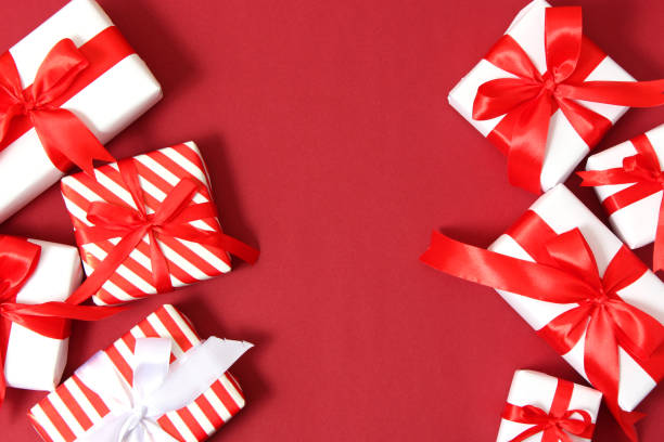 istock Set of beautifully wrapped gift boxes on a colored background top view. 1314616798