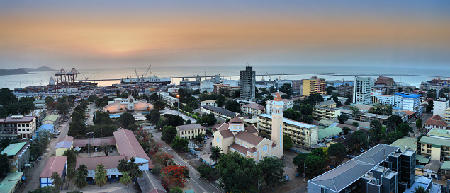 Gonakry, Guinea: panorama of the city center and the Atlantic - central avenues and boulevard, St Joseph de Cluny School, St. Mary's Cathedral, Ministry of Education, La Paternelle tower and Direction National du Tresor Public, embassies of France and Germany, Central Bank, etc - in the background the alumina storage (bauxite), container park and the pier of the harbor - Tombo Island is the economic and political center of Guinea.