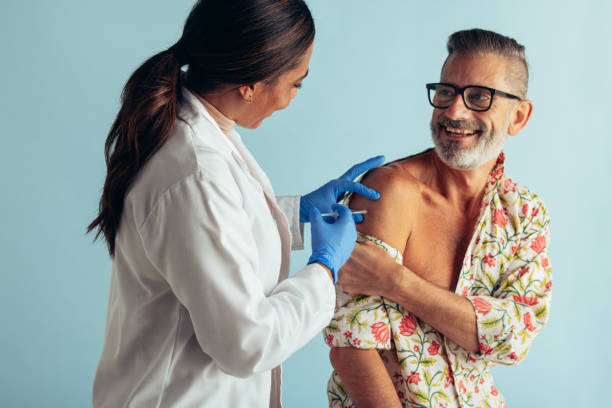 istock Doctor giving flu shot to patient 1314619612