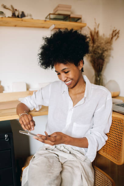istock Woman jeweler checking phone in studio 1314619958