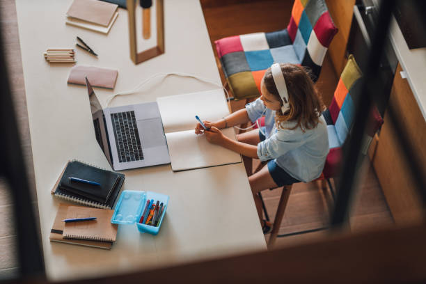 istock Little boy using laptop at home, online, video chatting, education, E-learning concept 1314623049