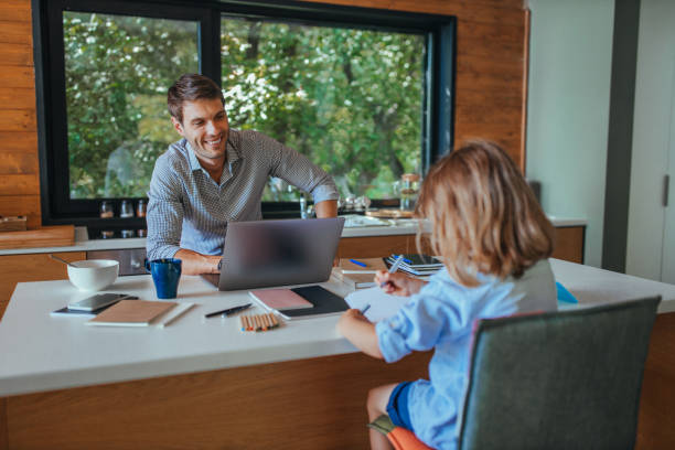 istock An affectionate young single father helping his son with his homework at home 1314623219