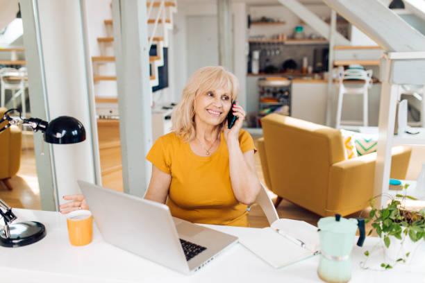 istock Mature entrepreneur making business calls from her home office 1314625731