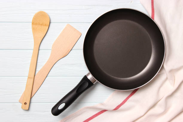 istock frying pan and on the wooden table top view. Cooking. 1314626043