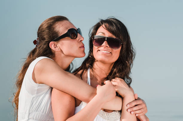 istock lesbian friends on the beach 1314626113
