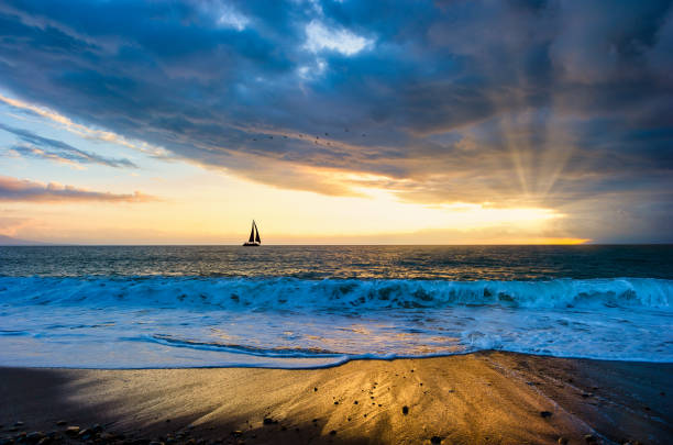 istock Sunset Sailboat Sun Ray Journey 1314629120